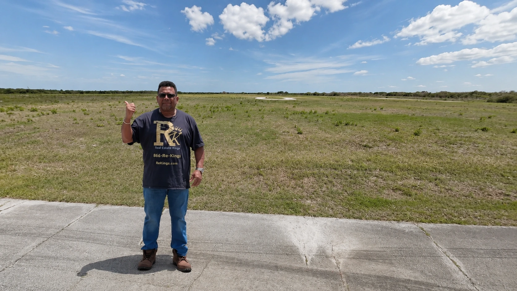 Brian Rice standing at 2426 Ottowa Cir SW and pointing toward the land